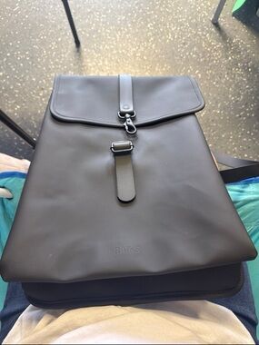 Rains Black Rolltop Backpack with Front Buckle